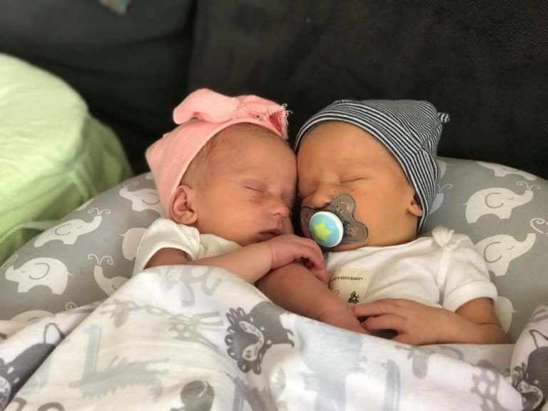 Newborn twins sleeping together